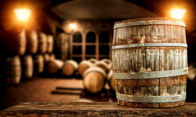 Wine barrels in dark cellar