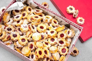 Traditional Christmas linzer candy in the shape of stars filled with jam