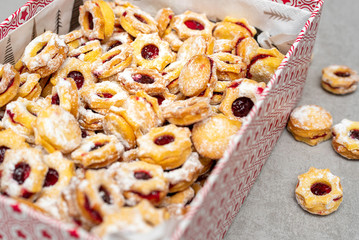 Traditional Christmas linzer candy in the shape of stars filled with jam