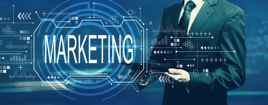 Marketing concept with businessman holding a tablet computer