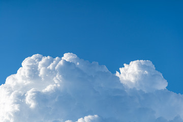 Naklejka na ściany i meble Blue sky white cumulus clouds before storm in summer cast shadow