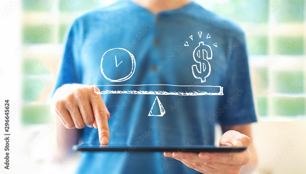 Aufkleber time and money on the scale with young man using a tablet computer