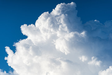Naklejka na ściany i meble Blue sky white cumulus clouds before storm in summer cast shadow