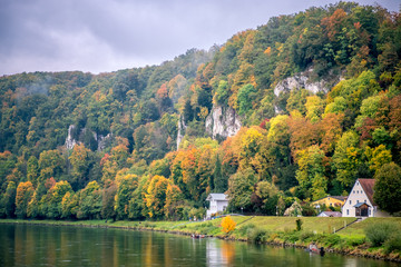 Fototapeta na wymiar Bright autumn. Yellow and orange trees. Kelheim, Danube river, Germany autumn