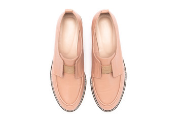 Beige female shoes isolated on white background.