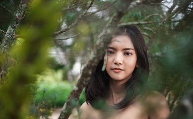 Close-up pictures of beautiful young Asian women, with perfect smooth tan skin. Concept of natural cosmetics and skincare.