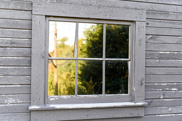 Fototapeta premium Old weathered wood barn farm window 