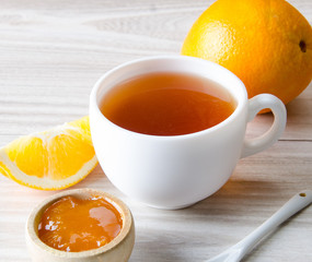 Cup of tea served with orange jam