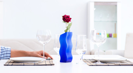 Man alone preparing for romantic date with his sweetheart