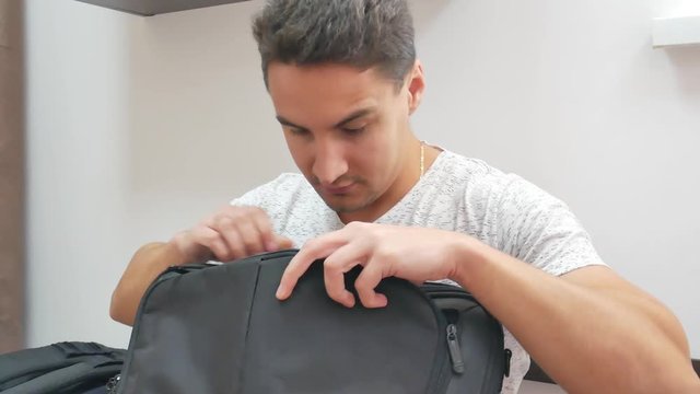 Handsome man found something in a bag