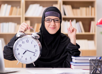 Muslim girl in hijab studying preparing for exams