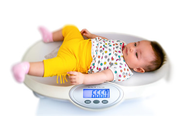 baby health and examination, weight measurement in hospital