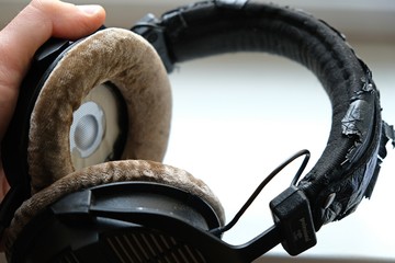 Old pair of headphones with selective focus 01
