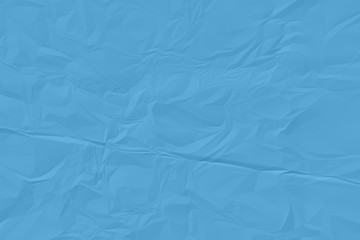 Obraz premium crumpled blue paper background close up