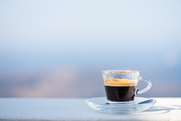 Cup of coffee on balcony