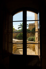 An Open Window Revealing the Beautiful View of an Old Medieval Fortress
