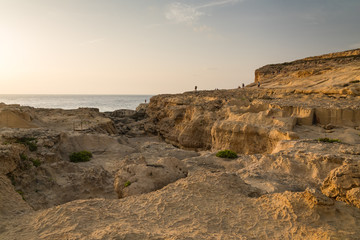 A Large Rocky Beach on the Island of Gozo at Sunset