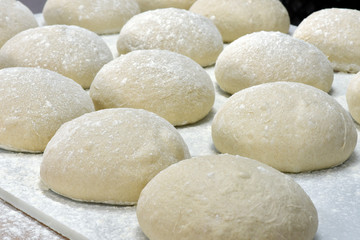 Fototapeta na wymiar Dough in fermentation to make sweet braided bread