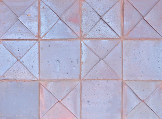 Background surface of regular ceramic tiles in square pattern.