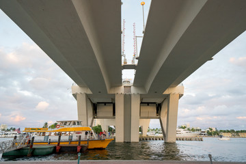 People on the Fort Lauderdale water taxi under the 17th Street Bridge
