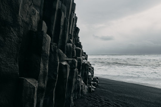 Rock Face At Black Sand Beach In Iceland