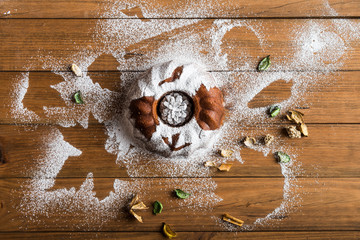 Sponge cake sprinkled with icing sugar.