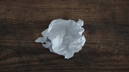 creative block, timelapse with scrunched paper sheet flattening up and then getting scrunched again