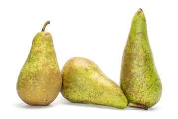 Group of three whole fresh green pear conference isolated on white background