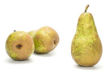Group of three whole fresh green pear conference one in focus isolated on white background