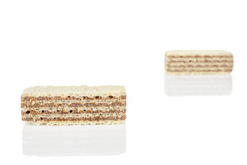 Group of two whole crispy beige hazelnut wafer cookie isolated on white background
