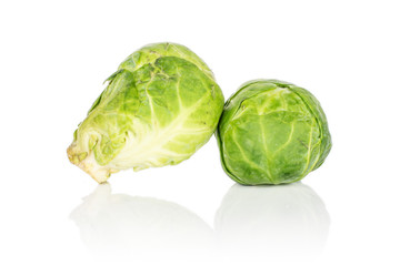 Fototapeta premium Group of two whole fresh green brussels sprout isolated on white background