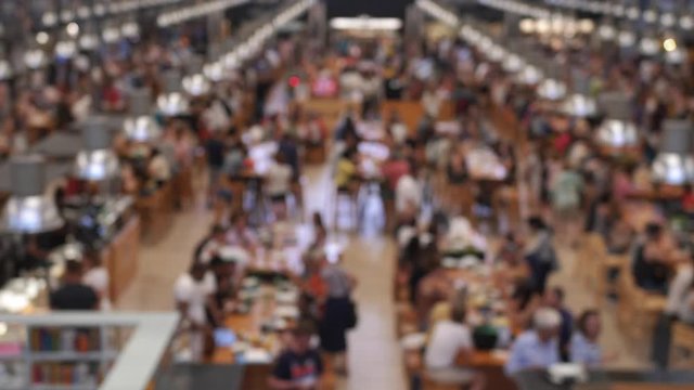 Anonymous Crowd in Food Hall Market Eating at Restaurant Tables