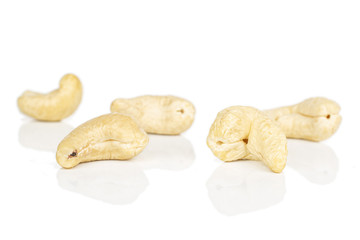 Group of five whole brown nut cashew isolated on white background