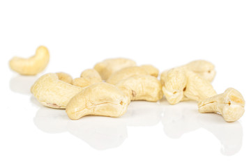 Lot of whole brown nut cashew heap isolated on white background
