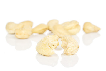 Lot of whole brown nut cashew front focus isolated on white background