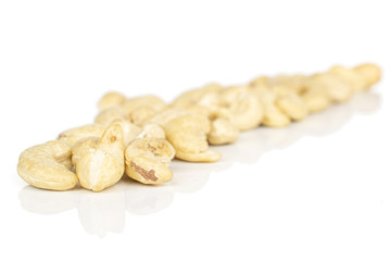 Lot of whole brown nut cashew diagonal isolated on white background