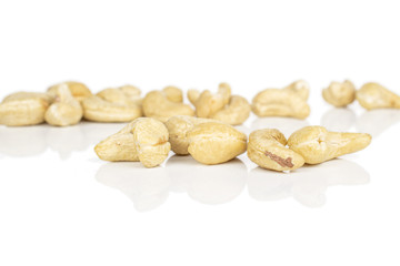 Obraz premium Lot of whole light brown nut cashew front focus isolated on white background