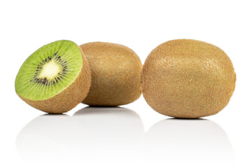 Group of two whole one half of exotic brown kiwi isolated on white background