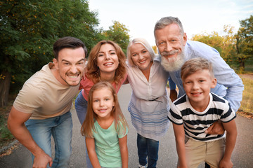 Happy family having fun in park
