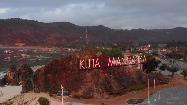 The sign of Kuta Mandalika during a sunrise. Aerial shot.