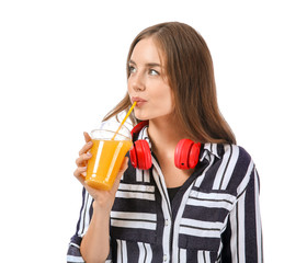Beautiful young woman with orange juice on white background