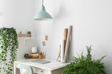 Modern stylish workplace with houseplants