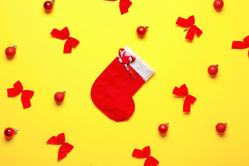 Beautiful Christmas composition with stocking on color background
