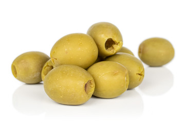 Group of nine whole marinated green olive isolated on white background