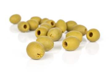 Lot of whole marinated green olive isolated on white background