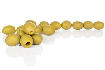 Lot of whole marinated green olive isolated on white background