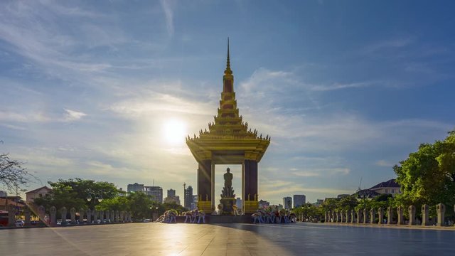 Time lapse of a Statue of King Father Norodom Sihanouk with blue and yellow sky background at central Phnom Penh, Capital of Cambodia.