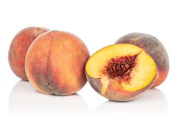Group of three whole one half of sweet red peach isolated on white background