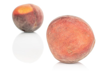 Group of two whole sweet red peach isolated on white background