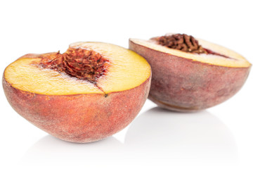 Group of two halves of sweet red peach isolated on white background